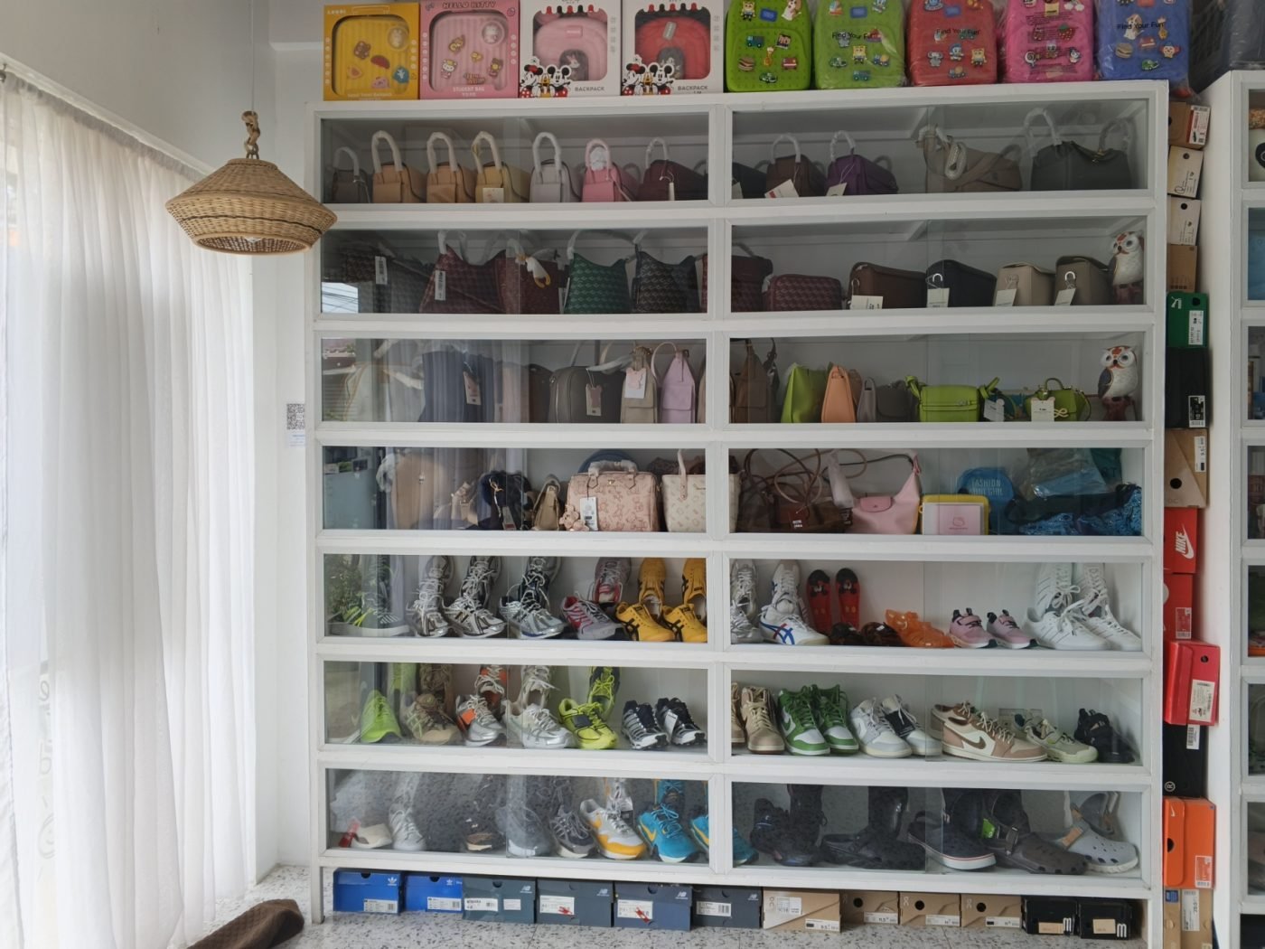 Imported bags and sneakers on display at AGAFE